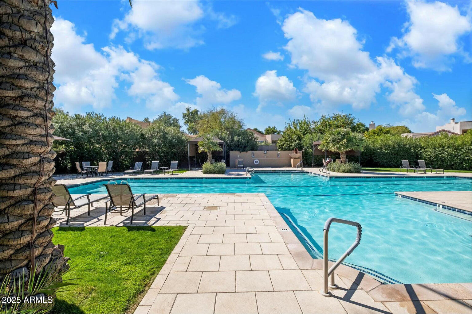 7710 East Gainey Ranch Road, Unit 139 Scottsdale, AZ 85258 - Photo 33 of 38 a view of a swimming pool with a patio
