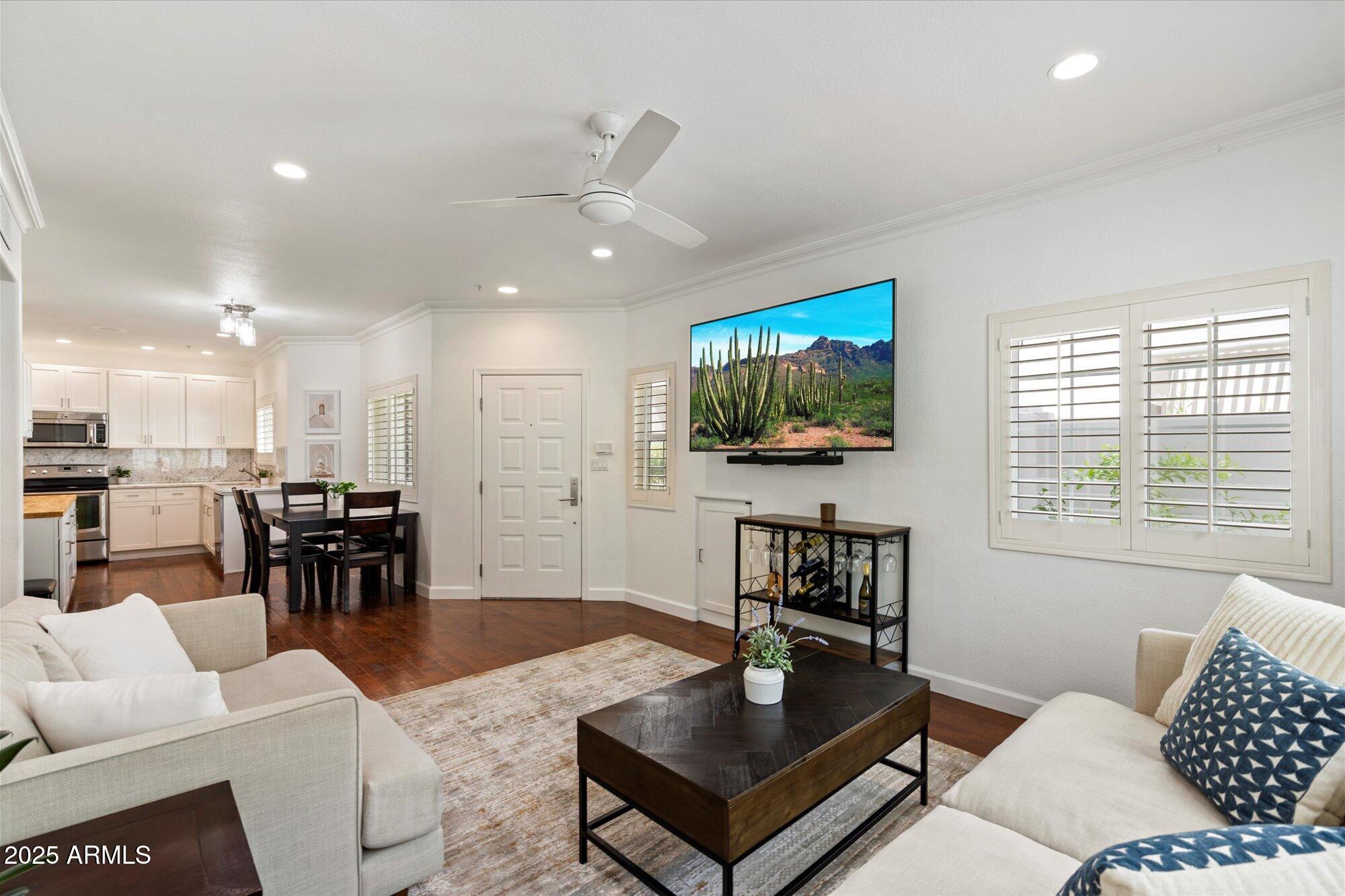 7710 East Gainey Ranch Road, Unit 139 Scottsdale, AZ 85258 - Photo 8 of 38 a living room with furniture and a flat screen tv