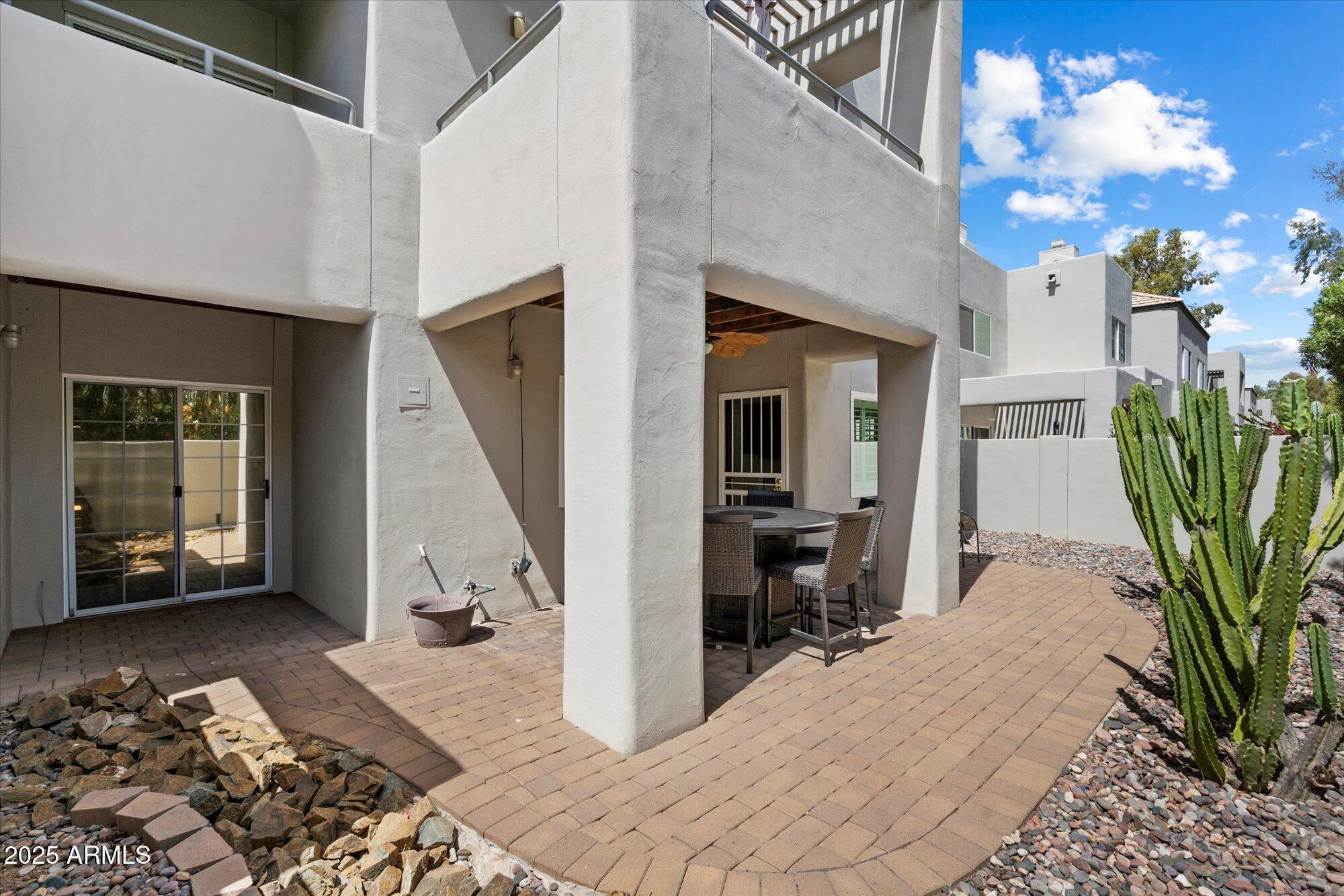 7710 East Gainey Ranch Road, Unit 139 Scottsdale, AZ 85258 - Photo 9 of 38 a view of a livingroom with furniture and floor to ceiling window