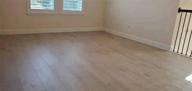 a view of entryway with wooden floor and stairs