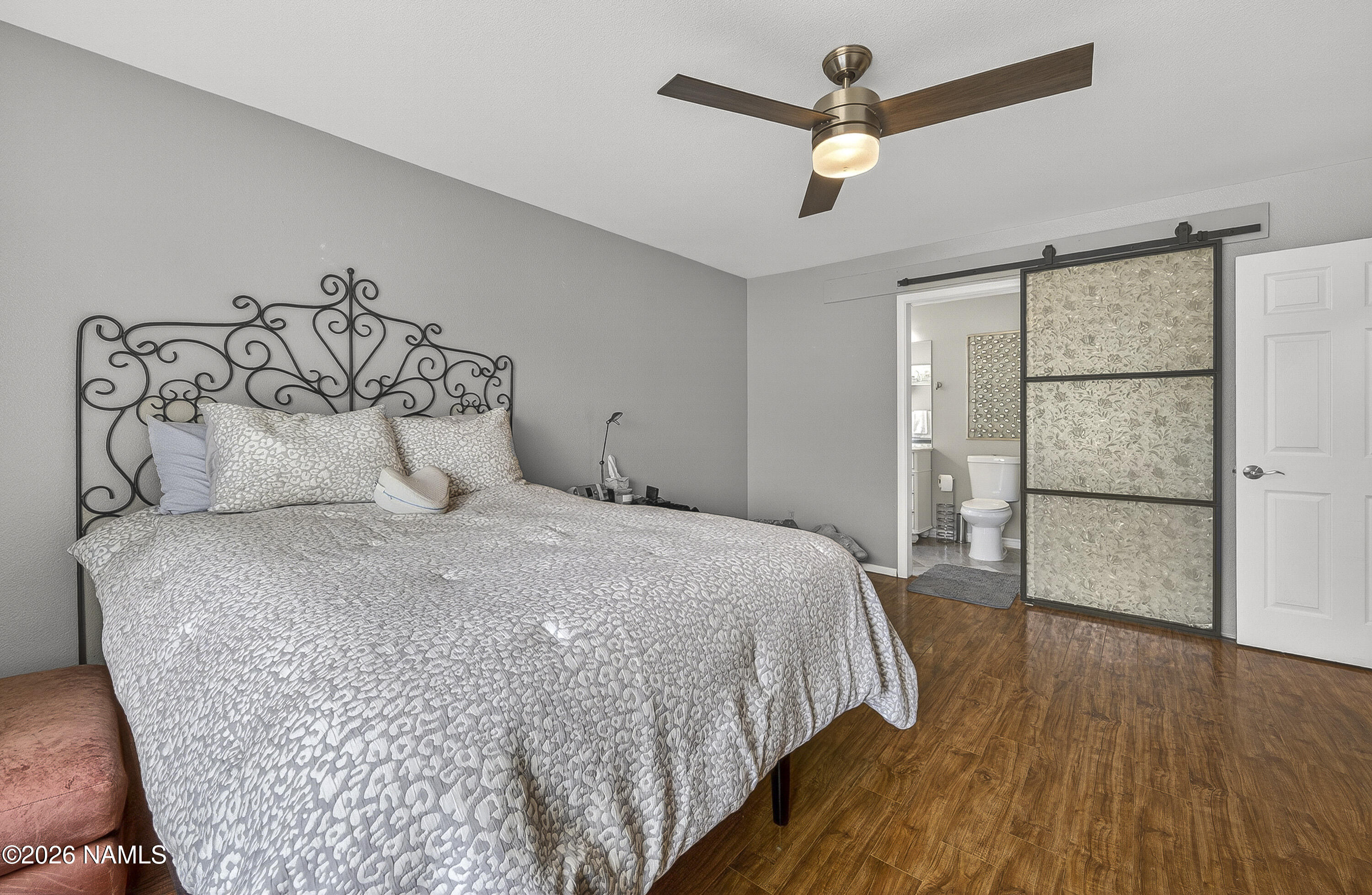 5640 East Atkinson Road Flagstaff, AZ 86004 - Photo 25 of 53 Primary Bedroom w/Decorative Barn Door