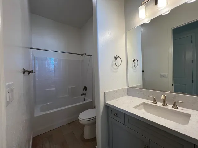 a view of cabinets and wooden floor