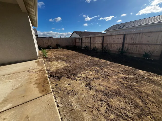 a view of a backyard of a house