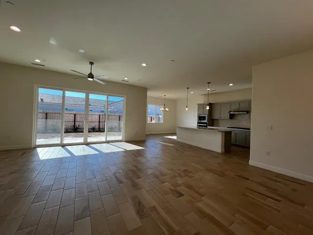 a view of kitchen with kitchen island microwave and stove