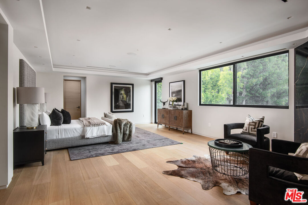 1729 Angelo Drive Beverly Hills, CA 90210 - Photo 15 of 30 a living room with furniture and a large window