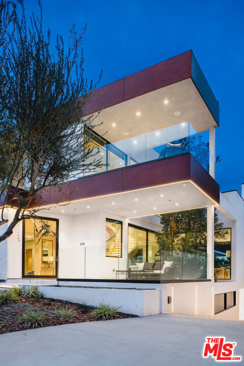 1729 Angelo Drive Beverly Hills, CA 90210 - Photo 25 of 30 a view of a building with a street