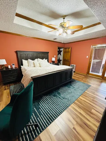 a bathroom with a toilet and a shower curtain