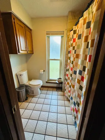 a bathroom with a shower and a sink
