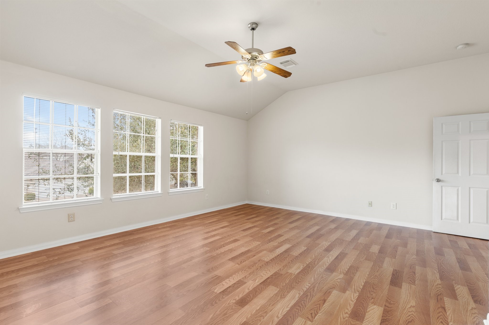 3111 Holly Ranch Drive Katy, TX 77494 - Photo 28 of 28 a view of an empty room with wooden floor and a window