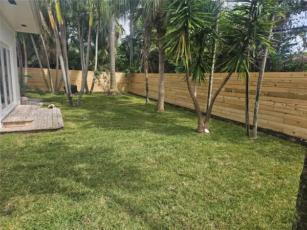 a view of a park with large trees