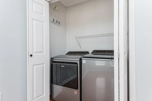 a utility room with dryer and washer