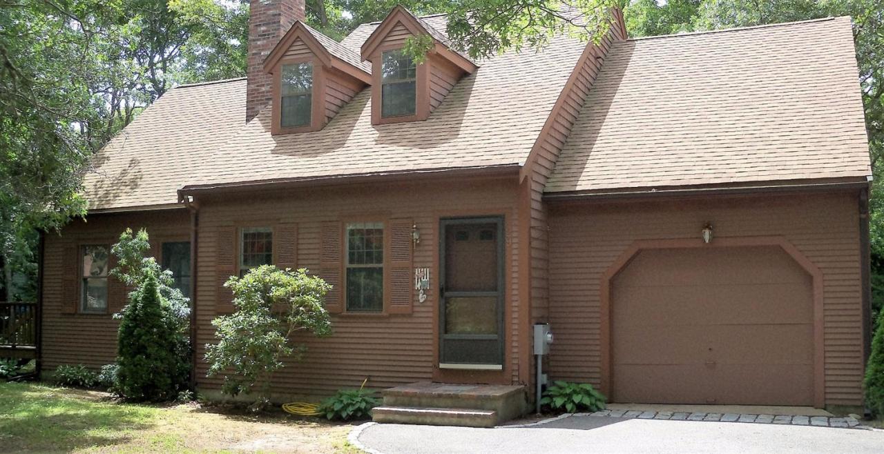 29 Nobadeer Road Centerville, MA 02632 - Photo 1 of 13 a front view of a house with garden