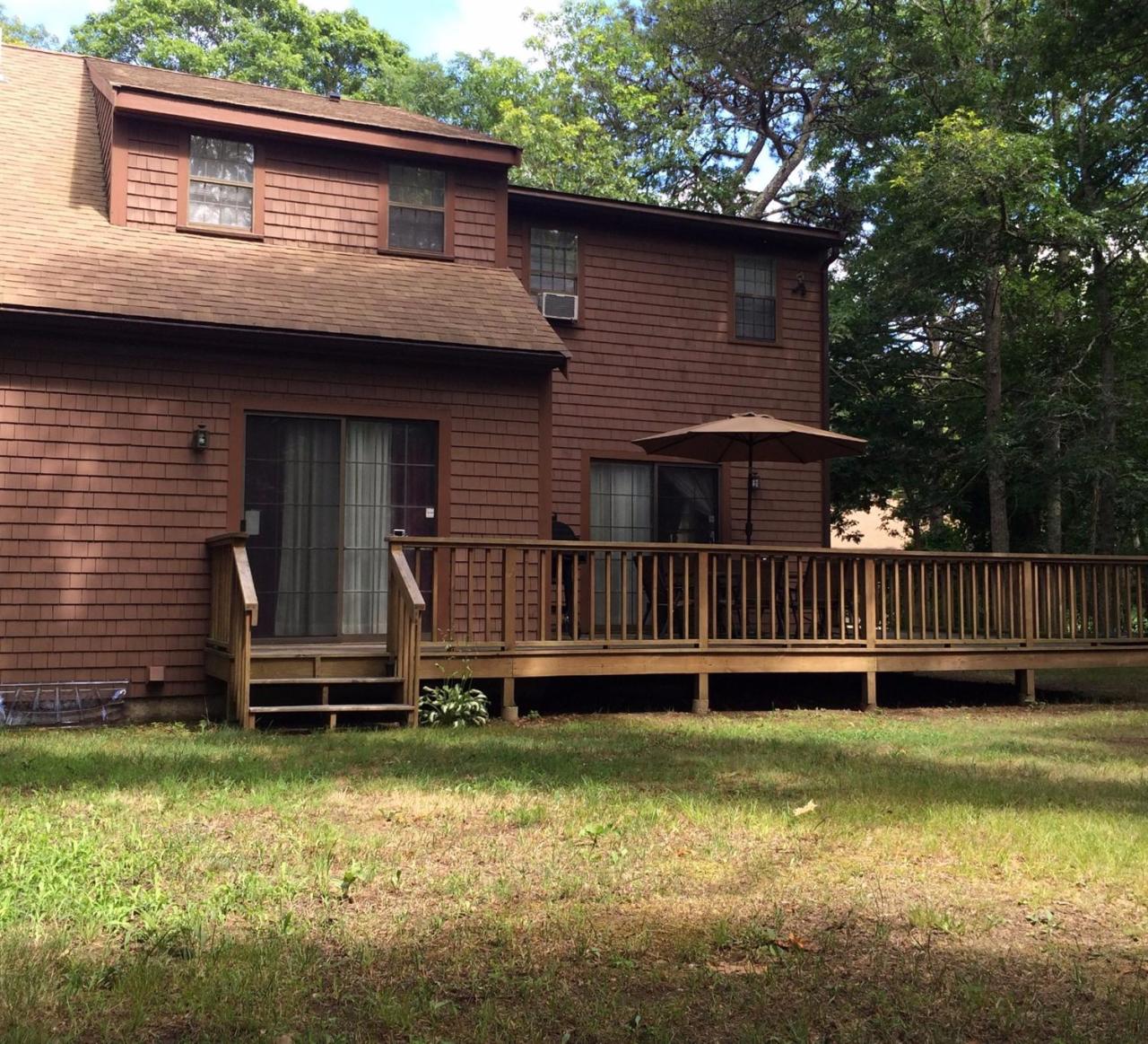 29 Nobadeer Road Centerville, MA 02632 - Photo 3 of 13 a front view of a house with a yard