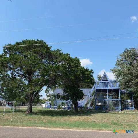 a view of a house with a big yard