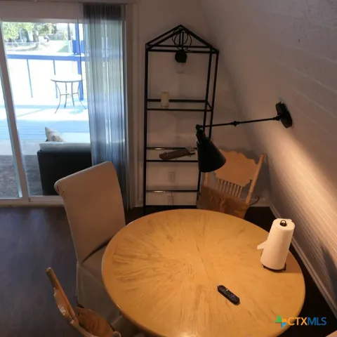 a view of kitchen and dining room with wooden floor