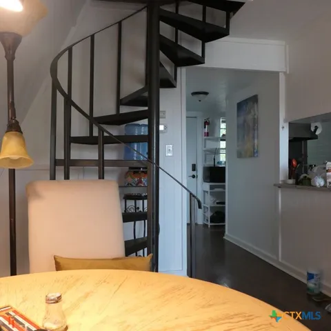 a living room with furniture and a rug