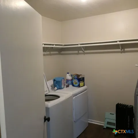 a bedroom with a bunk bed and a desk