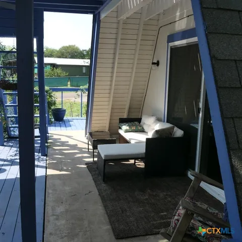 a view of a barn in the middle of a yard