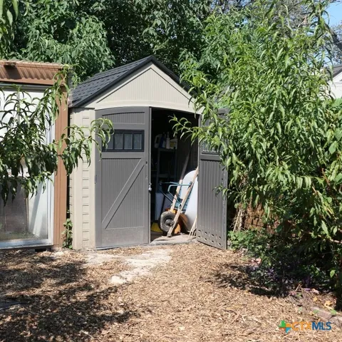 a living room with hard wood floors and a window