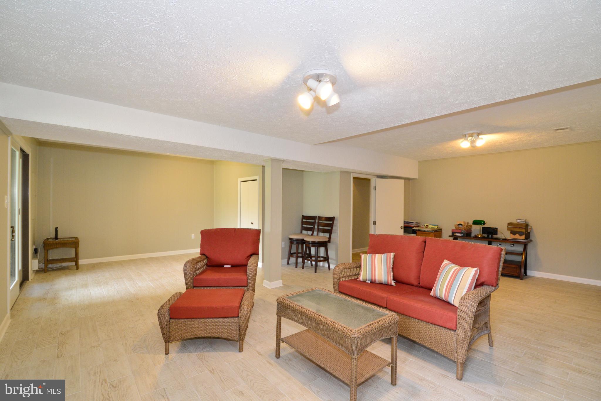 2269 Cedar Cove Court Reston, VA 20191 - Photo 21 of 27 Rec. Room with ceramic tile floors and a fireplace