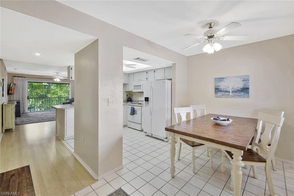 234 Pebble Beach Boulevard, Unit 306 Naples, FL 34113 - Photo 12 of 19 a workspace with furniture and window