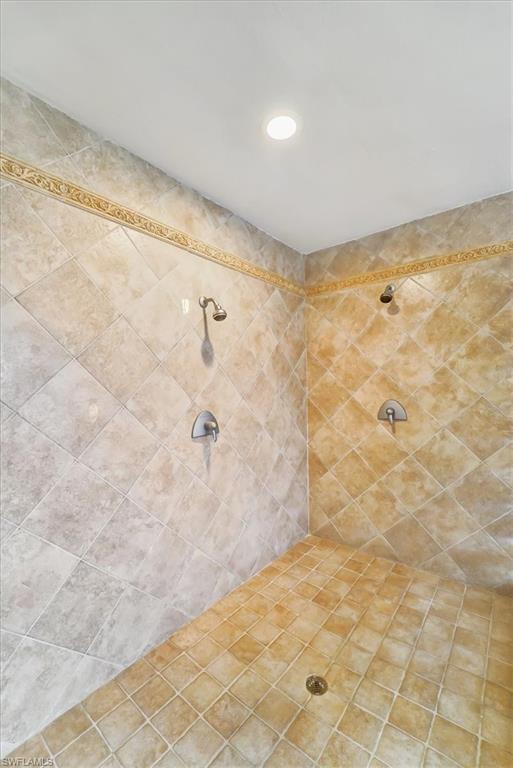 234 Pebble Beach Boulevard, Unit 306 Naples, FL 34113 - Photo 7 of 19 a bathroom with a shower