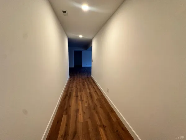 a view of an empty room with a fireplace