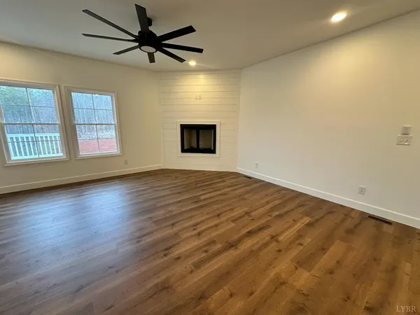 a view of kitchen with cabinets and wooden floor