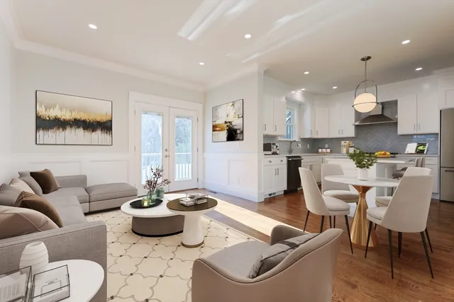 a living room with furniture kitchen and a table
