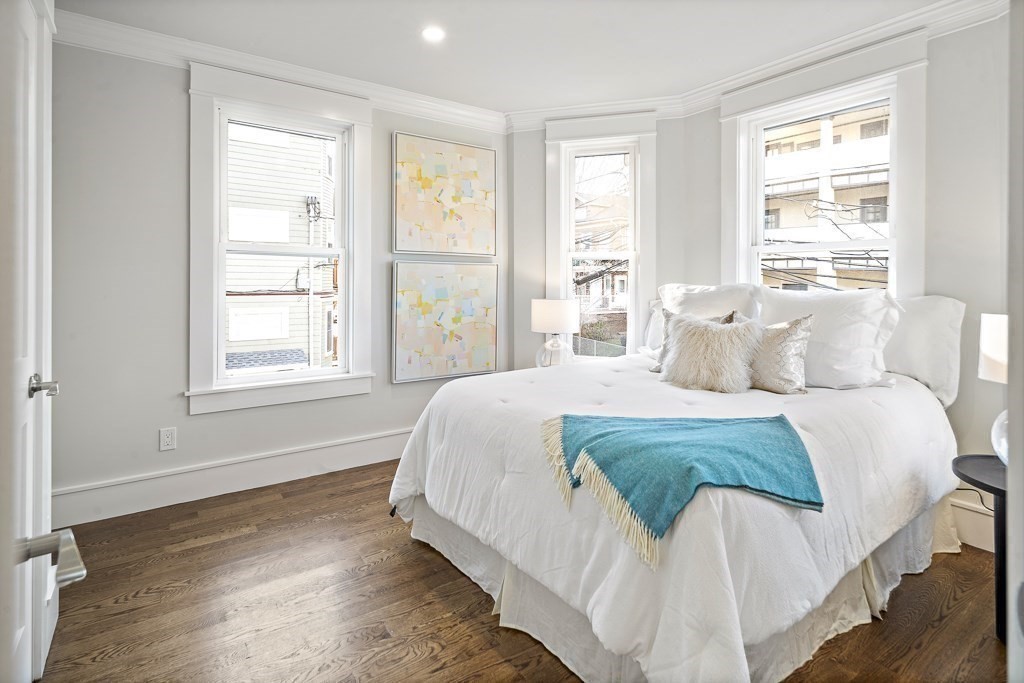 19 Fenwick Street, Unit 4 Somerville, MA 02145 - Photo 15 of 33 a bedroom with a bed and a window