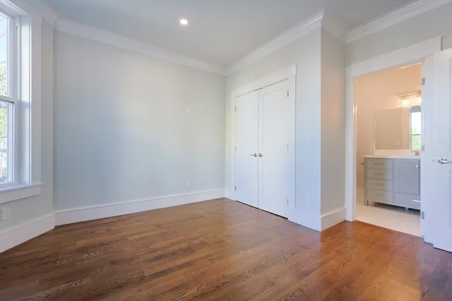 a work room with furniture and a flat screen tv