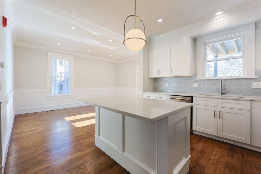 19 Fenwick Street, Unit 4 Somerville, MA 02145 - Photo 20 of 33 a kitchen with a sink cabinets and window