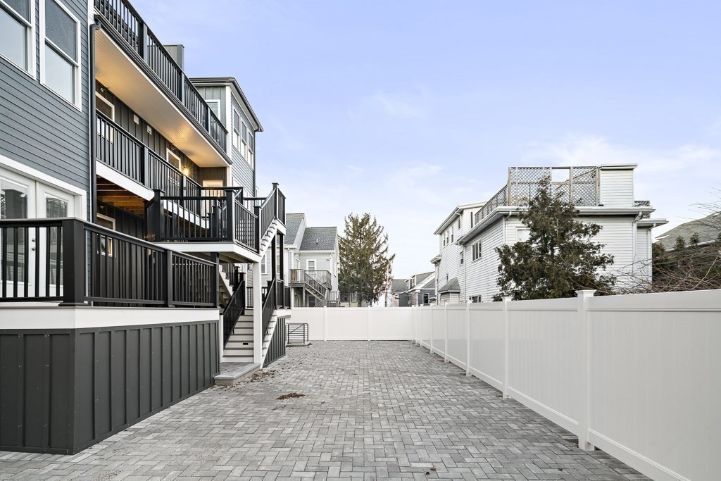 19 Fenwick Street, Unit 4 Somerville, MA 02145 - Photo 33 of 33 a view of a house with wooden fence