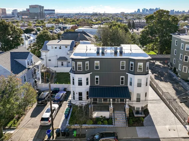 a view of a hallway with a wooden floor