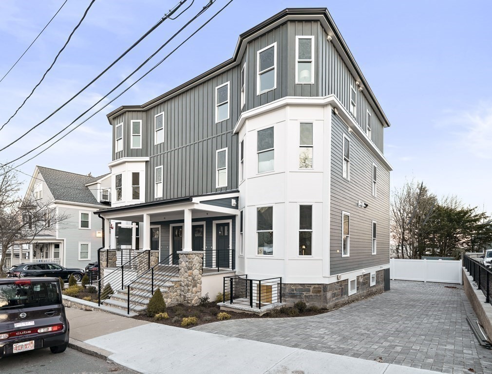 19 Fenwick Street, Unit 4 Somerville, MA 02145 - Photo 4 of 33 a front view of a house with a yard