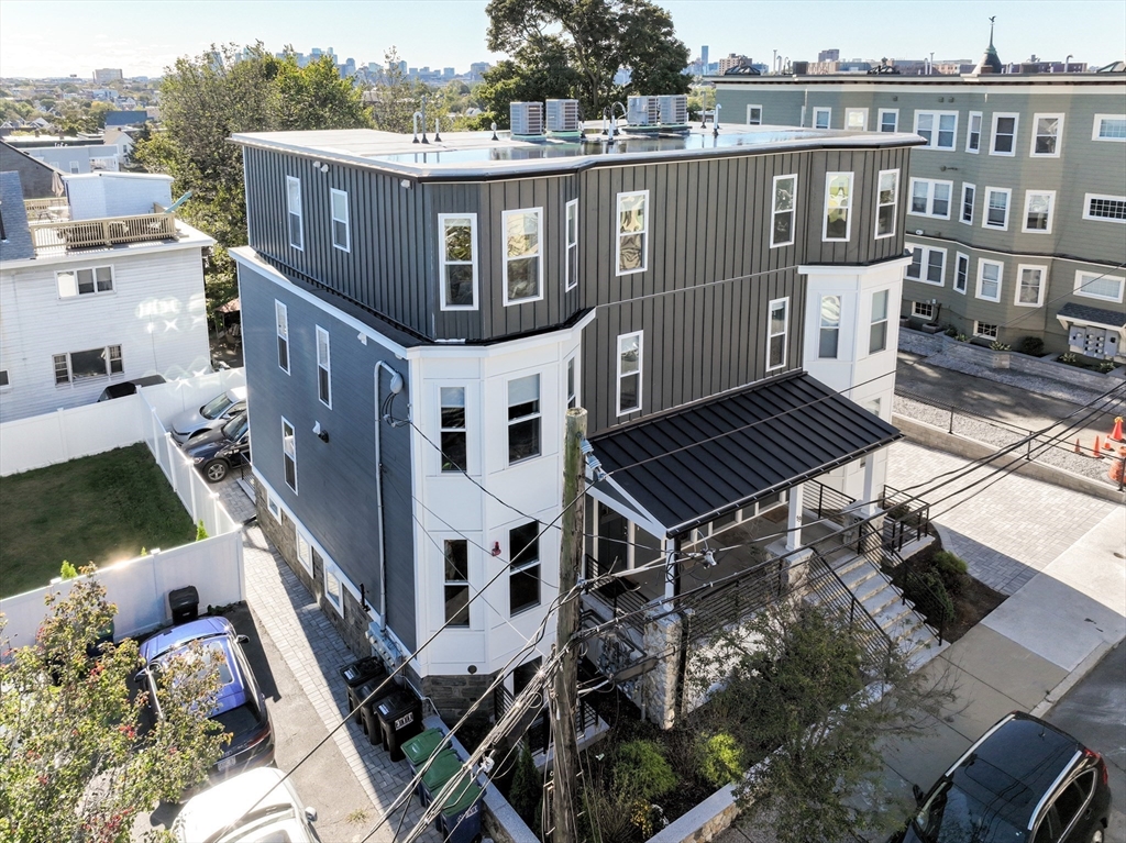19 Fenwick Street, Unit 4 Somerville, MA 02145 - Photo 6 of 33 a aerial view of a house with a yard