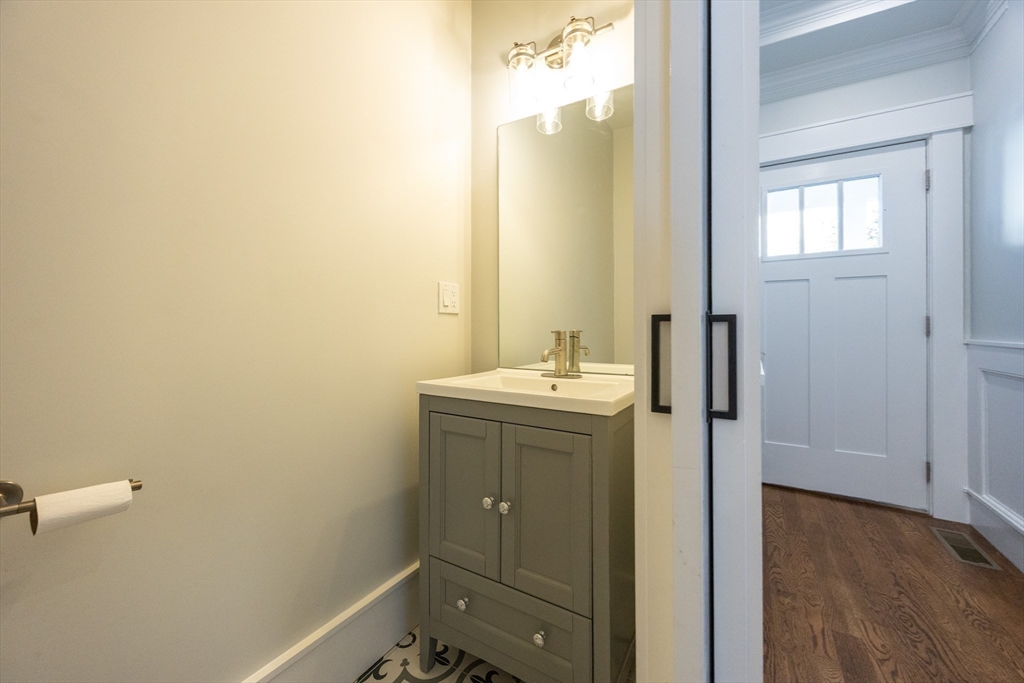 19 Fenwick Street, Unit 4 Somerville, MA 02145 - Photo 8 of 33 a bathroom with a sink and mirror