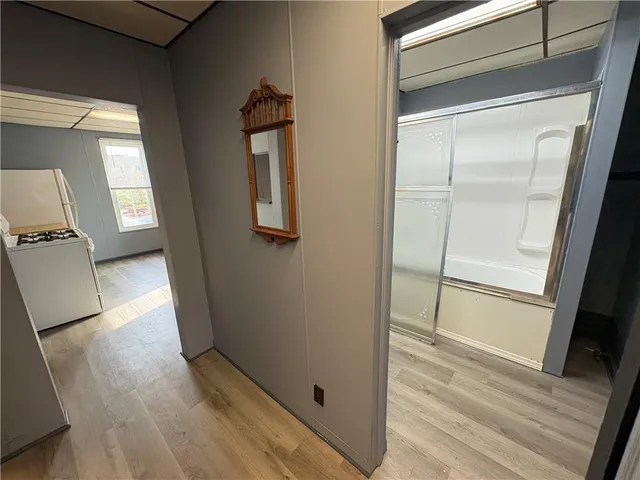 a view of front door with wooden floor