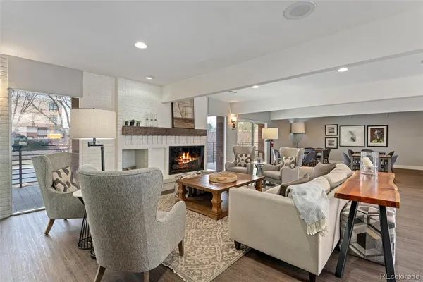 a kitchen with granite countertop white cabinets and stainless steel appliances