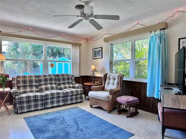 a bedroom with furniture and a window