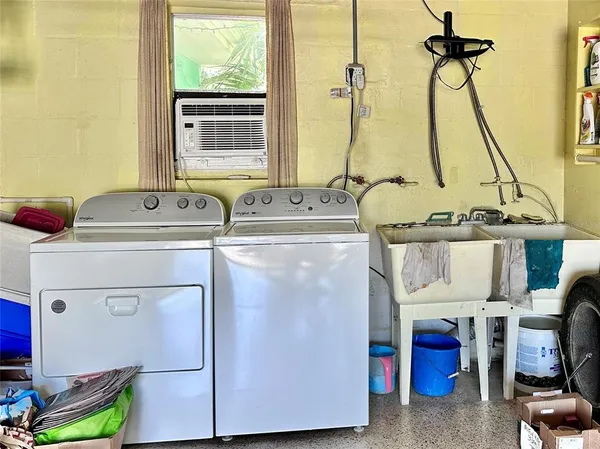 a kitchen with a sink and a stove