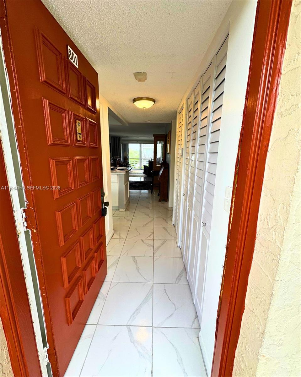 3776 Inverrary Boulevard, Unit 301R Lauderhill, FL 33319 - Photo 14 of 31 a view of a hallway with seating area