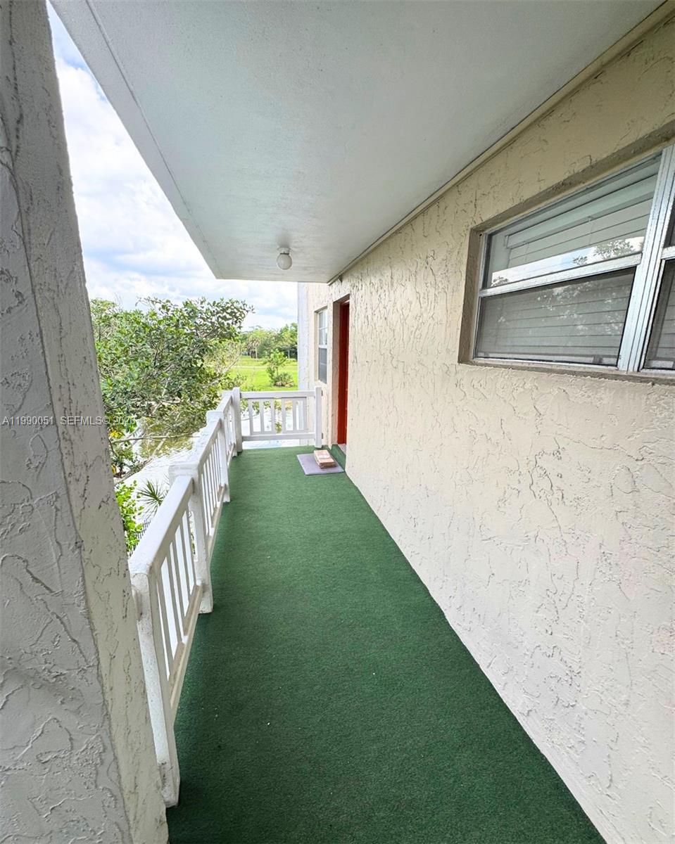 3776 Inverrary Boulevard, Unit 301R Lauderhill, FL 33319 - Photo 19 of 31 a view of a porch