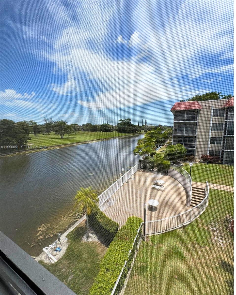 3776 Inverrary Boulevard, Unit 301R Lauderhill, FL 33319 - Photo 21 of 31 a view of a swimming pool with an outdoor seating