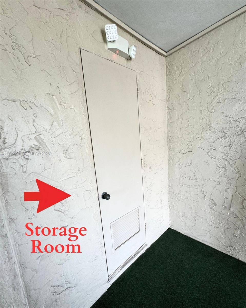 3776 Inverrary Boulevard, Unit 301R Lauderhill, FL 33319 - Photo 24 of 31 a bathroom with a shower and a shower curtain