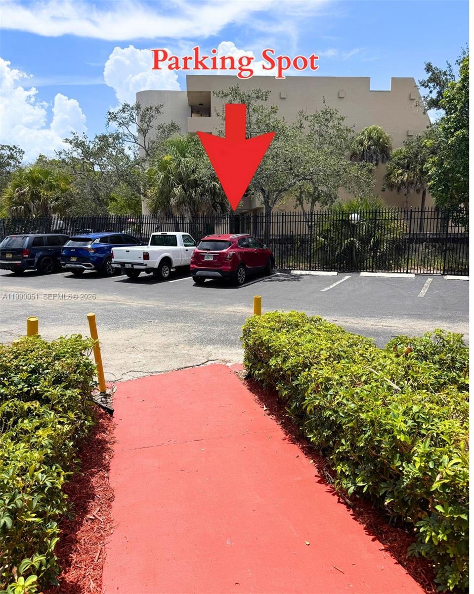 3776 Inverrary Boulevard, Unit 301R Lauderhill, FL 33319 - Photo 30 of 31 a view of a street with cars parked