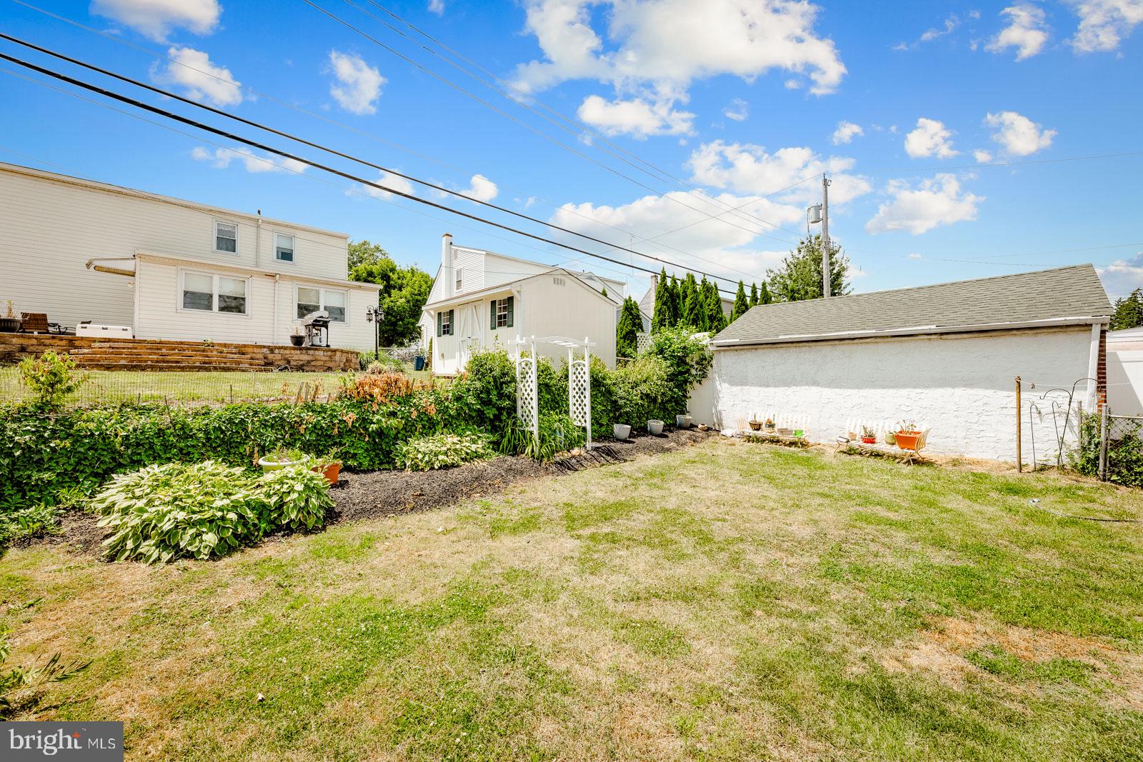 3118 Welsh Road Philadelphia, PA 19136 - Photo 38 of 38 Spacious backyard with lush greenery.