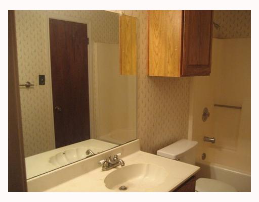 3038 Quail Springs Road, Unit B6 Corpus Christi, TX 78414 - Photo 6 of 7 a bathroom with a sink and a mirror