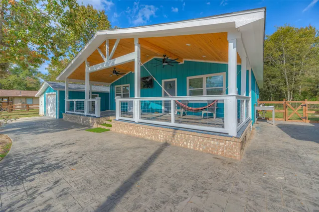 a view of house with a swimming pool
