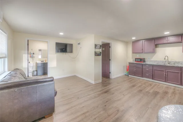 a backyard of a house with table and chairs